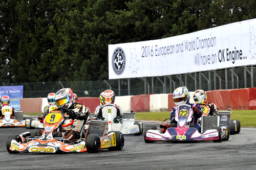 Competitors at the final KF-engined World Championships pass by the CIK-FIA's OK advertising banners
