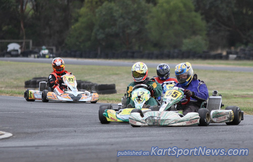 Andrew Stubbs (#55)  trying to hold off Steven Malkin (#12) in TAG 125 Restricted Masters
