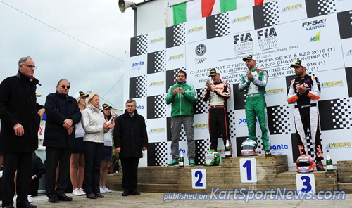 Ardigò celebrates on the podium his victory in KZ, together with Camponeschi and Iglesias, the local authorities and the CIK-FIA Vice-President Kees van de Grint