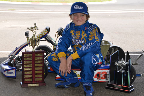 Jac Preston with Warwick Kart Club's perpetual “Most Improved Junior” trophy and his 2013 Cadet Champion trophy