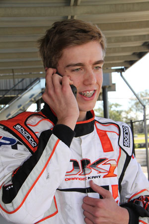 A very excited Matthew Smith from Rotax Light calls his father to tell him he has qualified on the front row