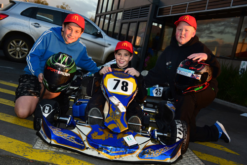 (L to R) Junior karters Kyle Love, Connor Griffin & Lucas Dickenson participate in an event promotion at their local Launceston McDonald's restaurant on Tuesday
