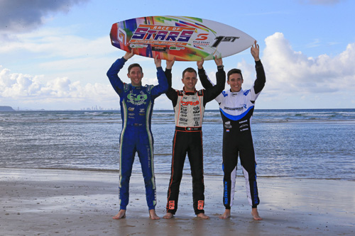 New Zealand's Daniel Bray, Italian Davide Forè and Dutchman Marijn Kremers with the 2015 Champions Surfboard on the Gold Coast