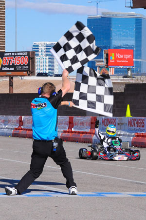 Christchurch karter Matthew Hamilton greets the chequered flag to win the S4 Masters Stock Moto class at the 17th annual SKUSA SuperNationals meeting in Las Vegas on Sunday