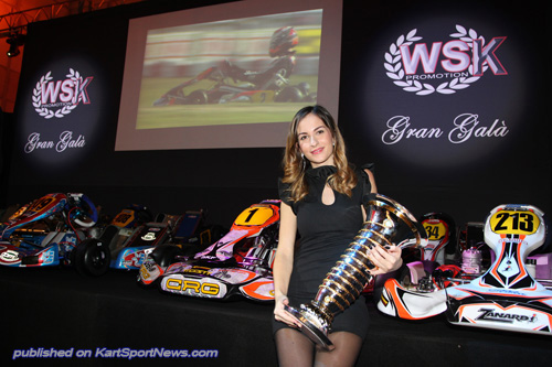 Nicole Tinini holding the “Driver of the Year” trophy given to Max Verstappen